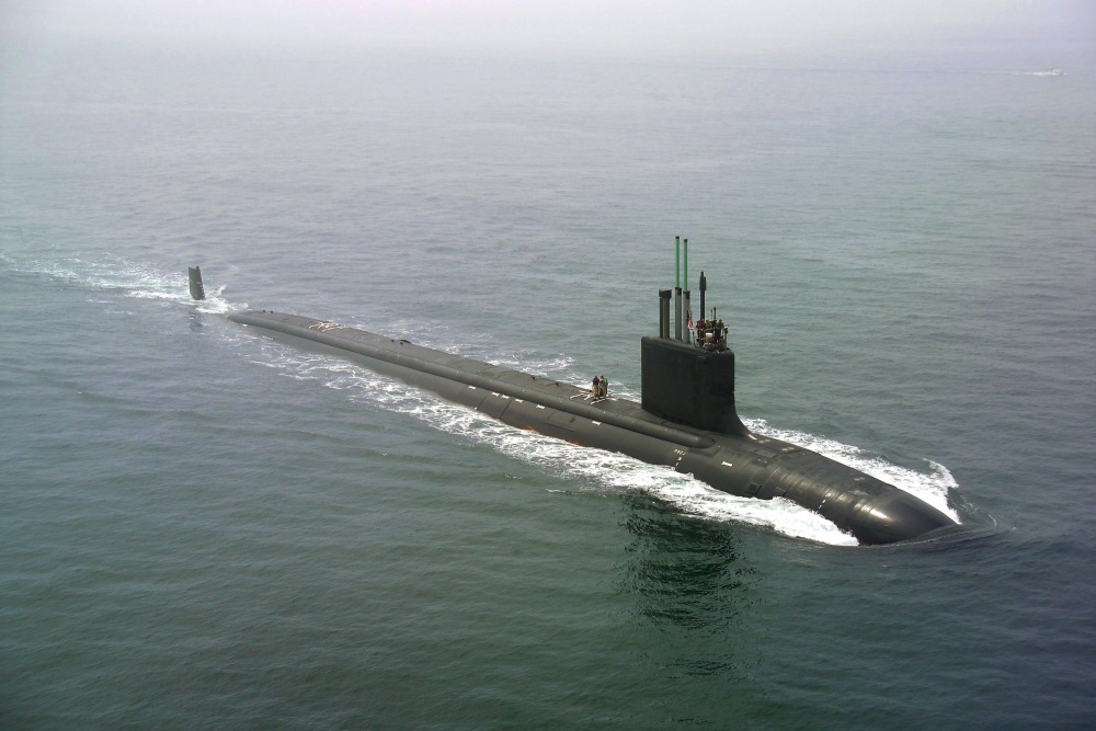 A submarine, belonging to the types of boats, traveling in the ocean.
